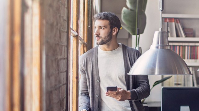 Man standing at window