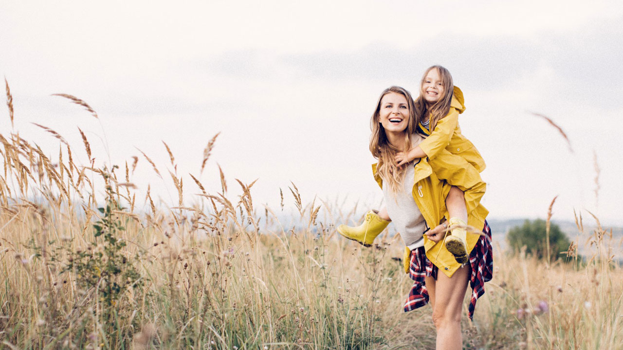 Woman holding a child on her back