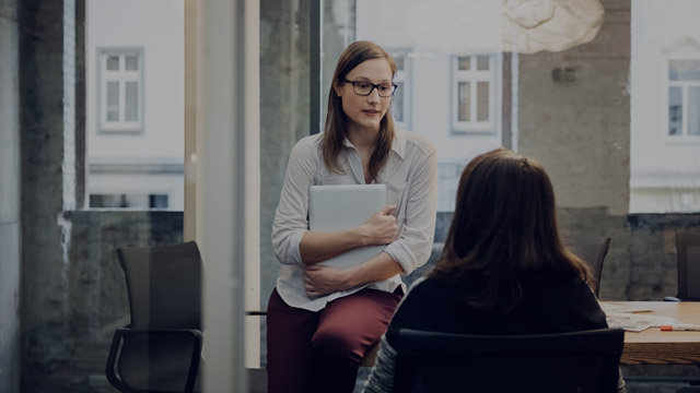 Businesswomen in meeting small overlay