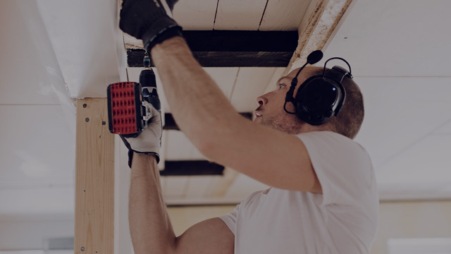 Handyman fixing ceiling small overlay