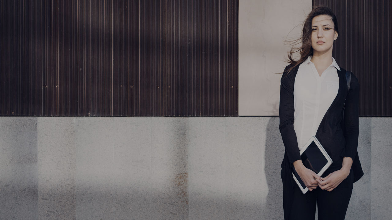 Young business woman with tablet.