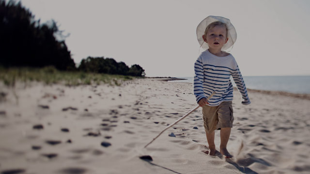 boy playing on beach small overlay