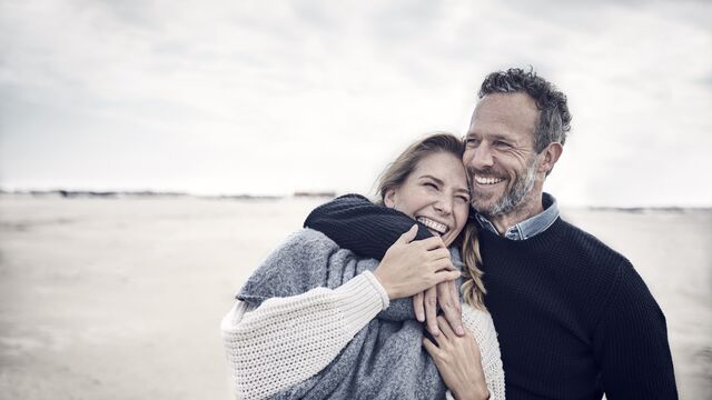 Couple hugging in kitchen 